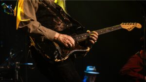 Stevie Rave On guitarist Joe Breher performing intense Stratocaster solo live on stage, SRV tribute band in Loveland Colorado